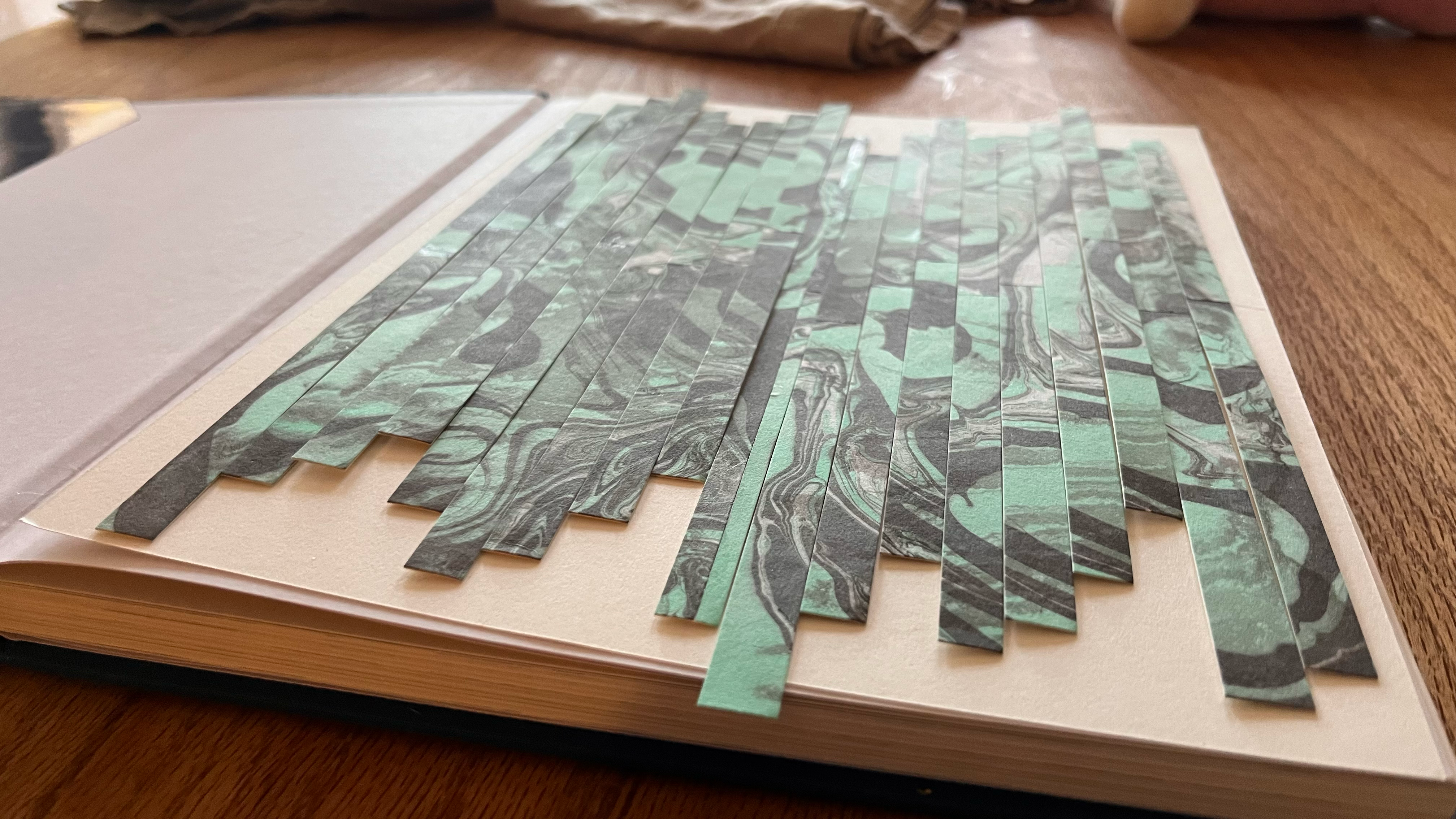 Detail of the suminagashi marbling paper cut into strips